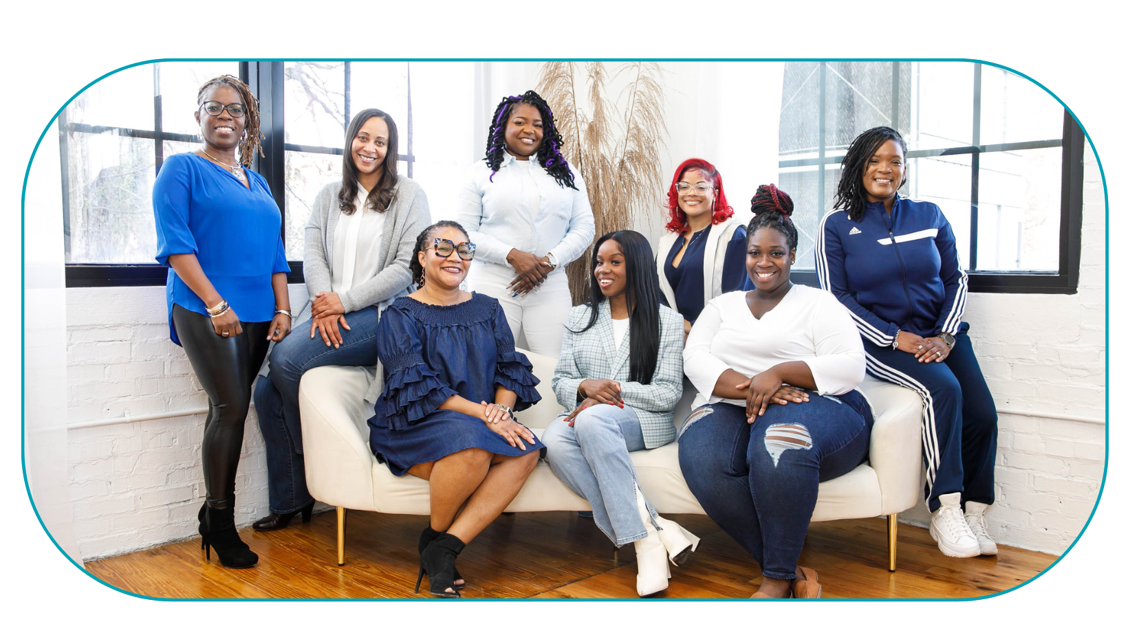 Eight Black Therapists wearing blue and white posing for photo in natural light. Representing Simplicity Psychotherapy group practice for Black men and women