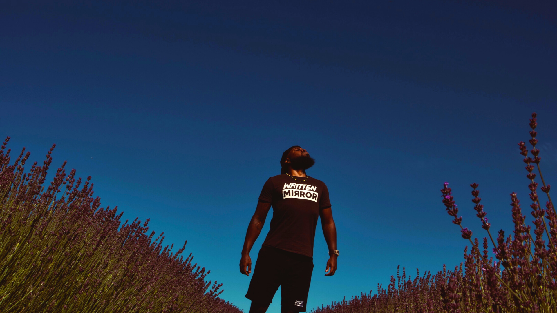 blue sky | ACT Therapy in Atlanta, GA | ACT therapist near me | ACT for anxiety in Georgia | 30135 | 30004 | 30034 Image of a Black man standing proudly in front of a blue sky. Representing the freedom you can get with ACT therapy for anxiety or depression. Get support from an ACT therapist in Atlanta, Georgia.