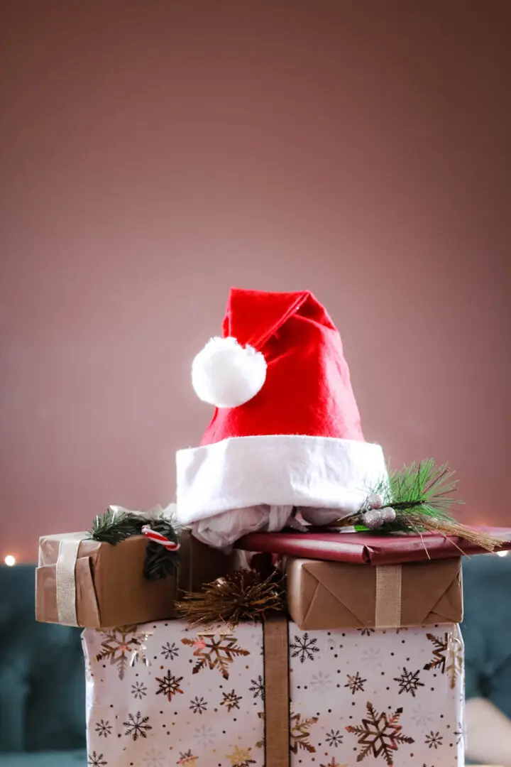 Holiday Self-Care Tips: 4 Steps to Peace | Finding Calm Amidst the Holidays | 30080 | 30339 | 30067 | 30213 | 30097 Christmas hats and presents, symbolizing holiday joy and the importance of incorporating self-care for peace and stress relief