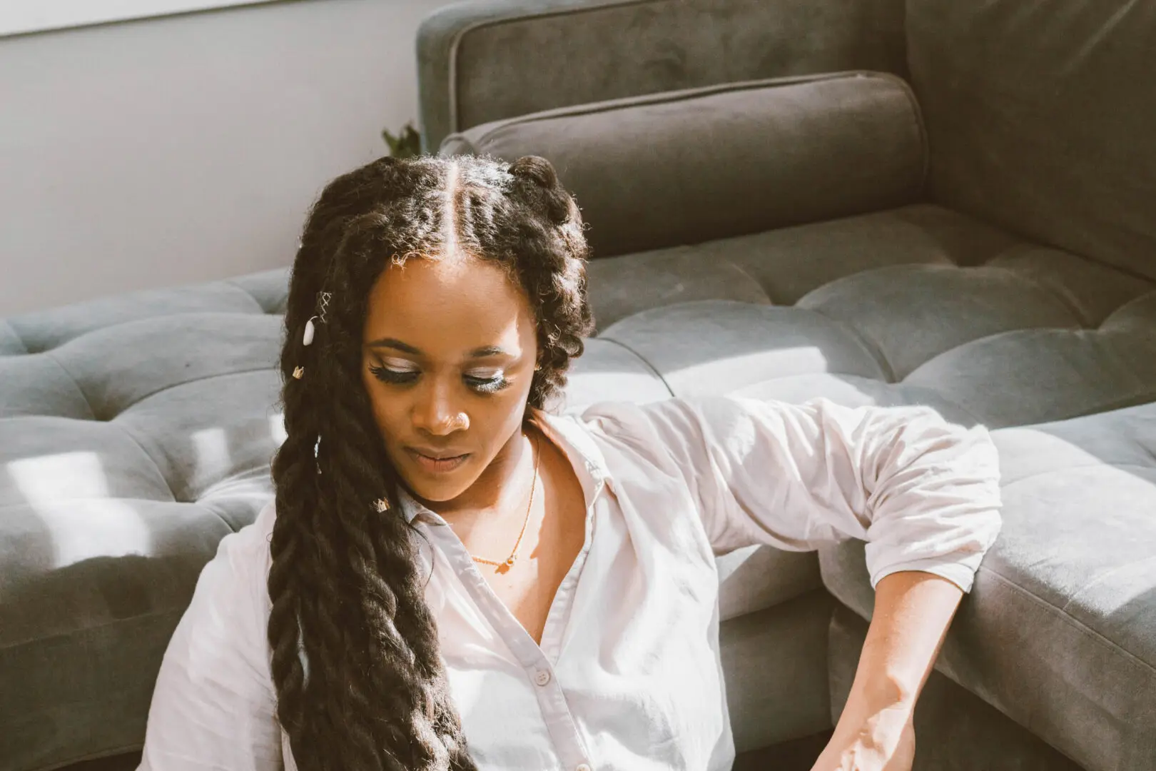 Image of a woman of color sitting on the floor by a couch. There are a lot of options when it comes to anxiety help. With anxiety therapy in Atlanta, GA you can start getting to the source of your worry. An anxiety therapist can help you understand where your anxiety symptoms are coming from. Call today!