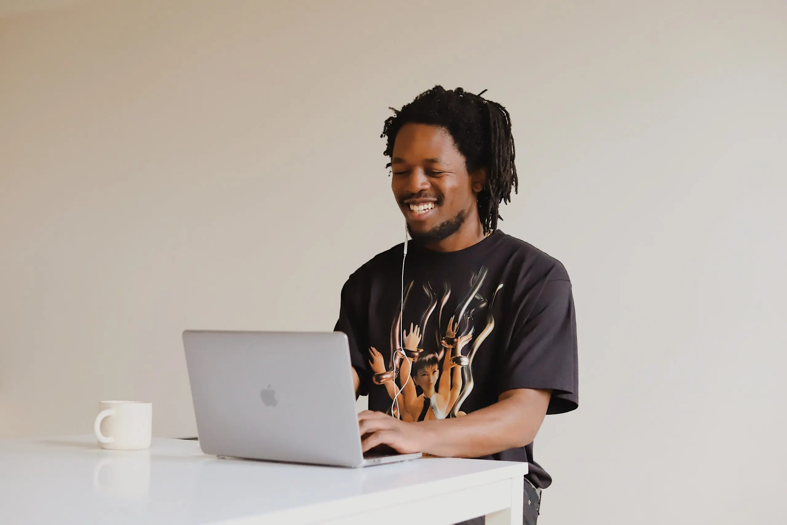 smiling man | online therapy Georgia | online counseling in Georgia | online therapist in Georgia | 30080 | 30339 | 30067 Image of an African-American man smiling during an online therapy session from a cafe in Georgia. With online counseling, you can meet with an online therapist from a cafe, at work, or at home.
