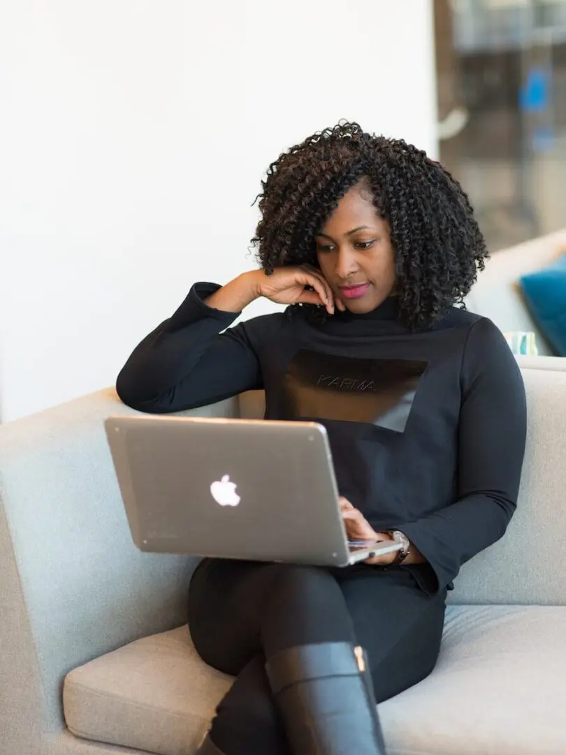 white couch | online therapy Georgia | online therapy in Atlanta | online therapist in Georgia | 30135 | 30004 | 30034 Image of an African-American woman sitting on her couch for an online therapy session in Atlanta, GA. You can connect with an online therapist in Georgia just as effectively as meeting with a counselor in person.