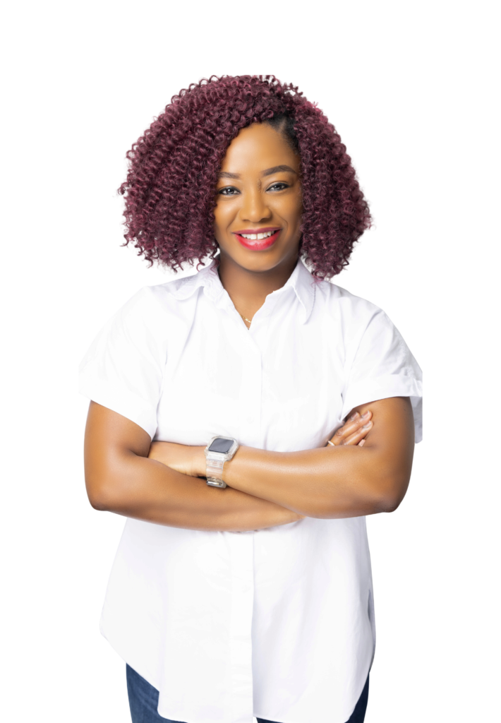 Image of friendly Black female mental health professional in Atlanta, Georgia, wearing white shirt, jeans, and red natural hair, providing compassionate therapy for anxiety