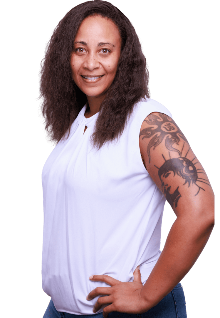 Smiling Black woman anxiety therapist with natural hair, wearing a white top, in her Atlanta, Georgia office, offering a welcoming and therapeutic environment