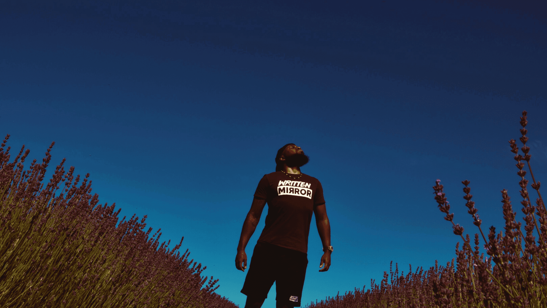 Image of a Black man standing proudly in front of a blue sky. Representing the freedom you can get with ACT therapy for anxiety or depression. Get support from an ACT therapist in Atlanta, Georgia.