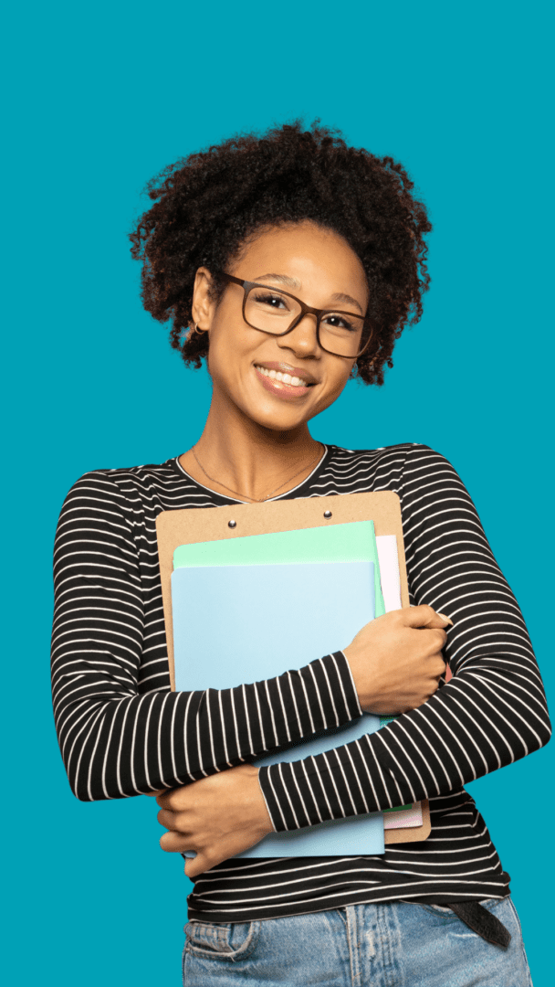 Counselor intern wearing glasses holding documentation offering sliding scale therapy services for affordable mental health care