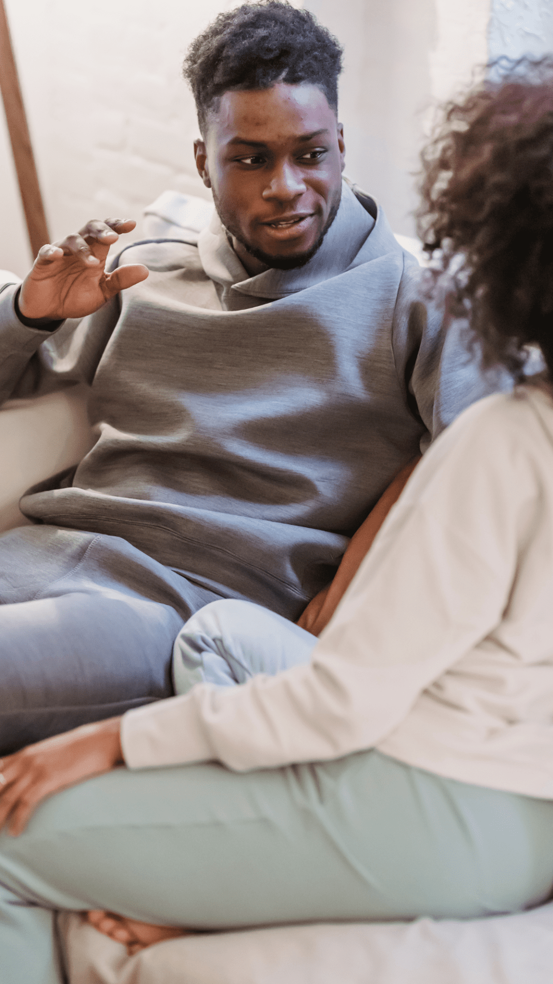 Image of a couple facing each other and talking. This represents what effective communication looks like which is taught during black couples therapy and black marriage counseling in Atlanta, GA.