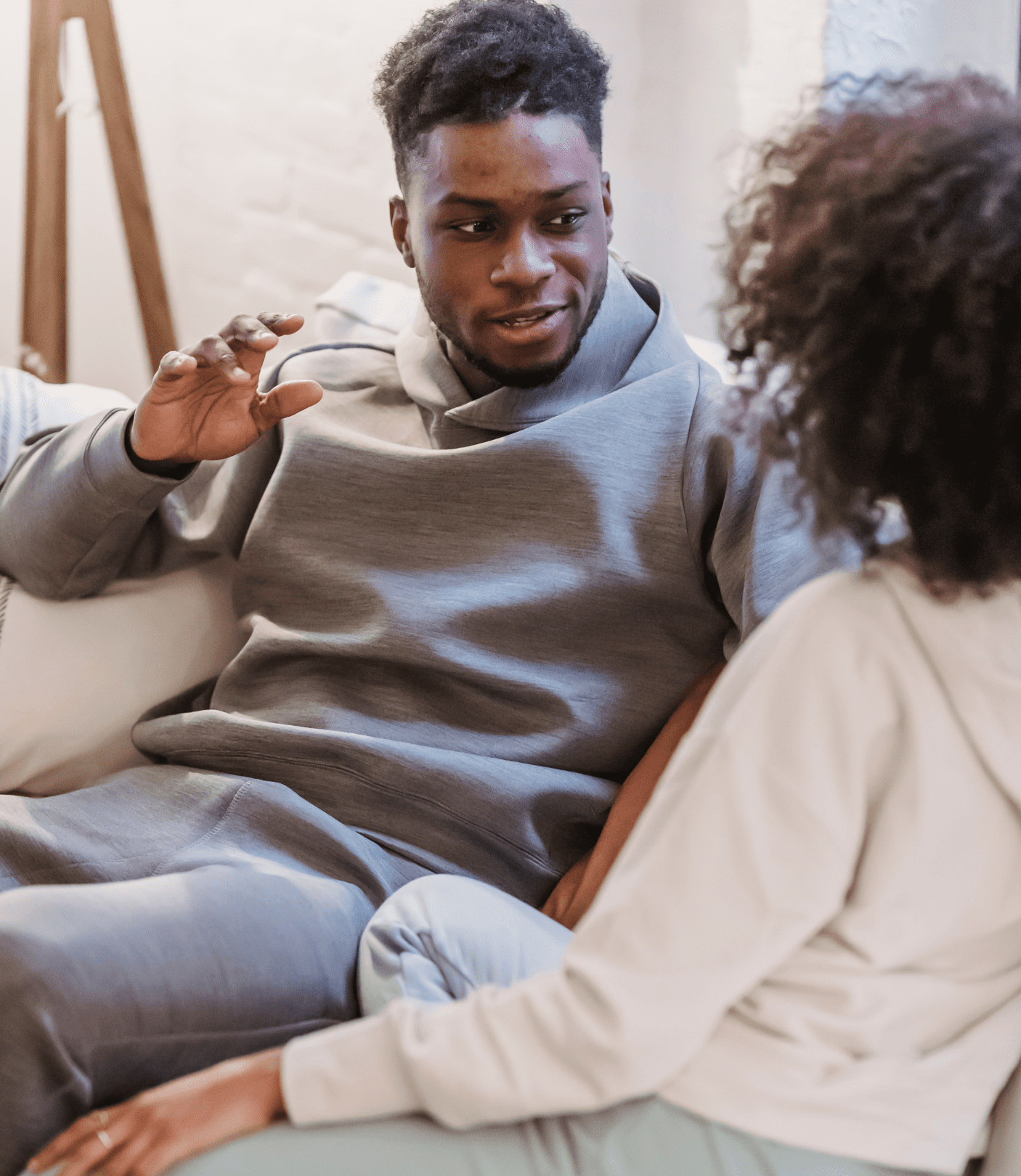 Image of a couple facing each other and talking. This represents what effective communication looks like which is taught during black couples therapy and black marriage counseling in Atlanta, GA.