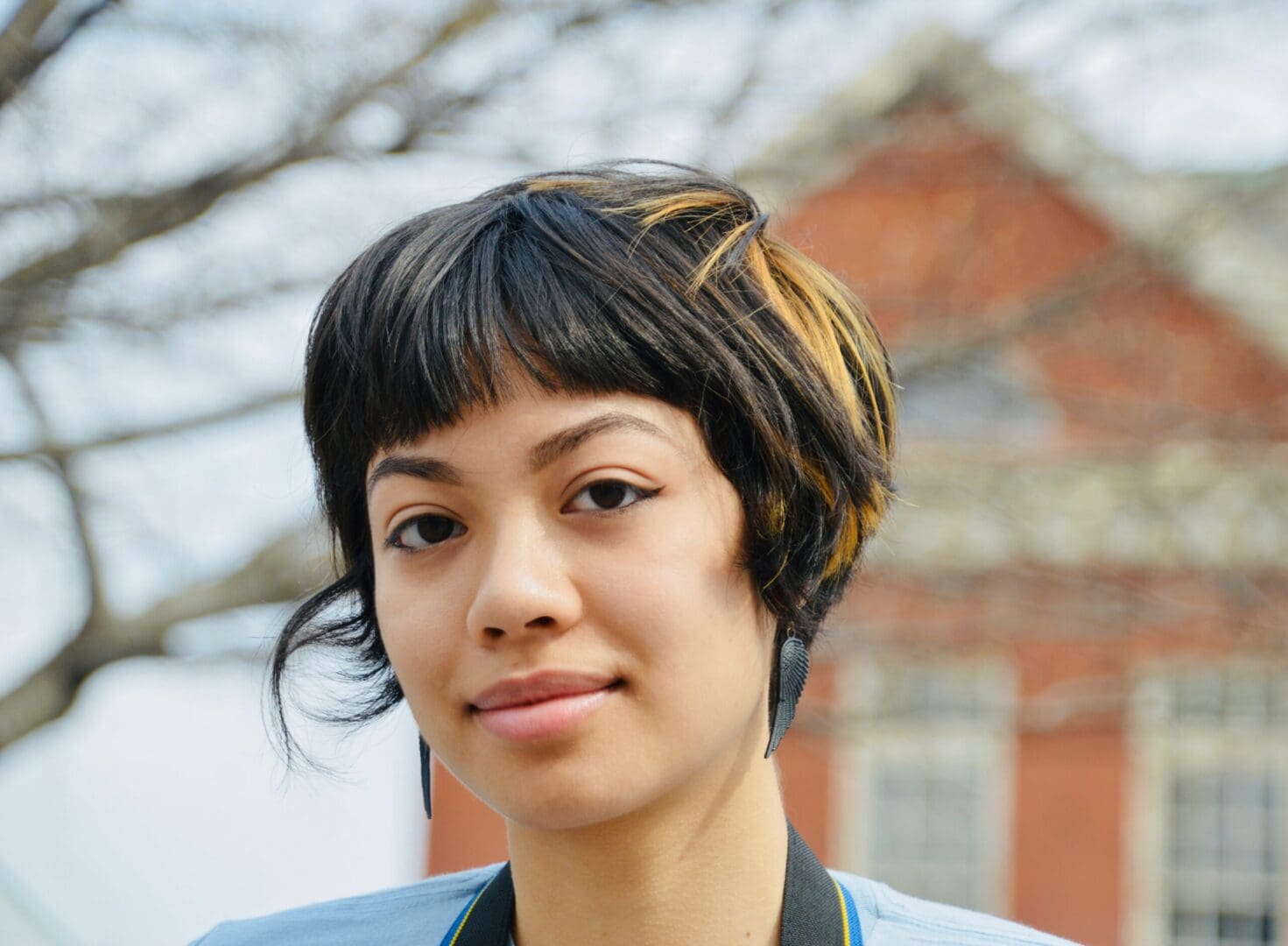 Image of an African American woman looking off to the side. Representing the pain that grief and loss counseling can help with. During grief counseling in Atlanta, GA a grief counselor will help you make sense of life after loss.