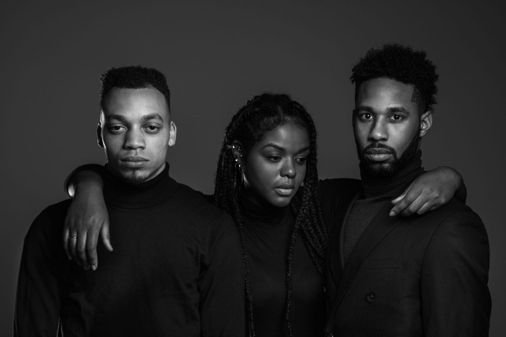 Black and white image of three people standing together. This shows that anyone can benefit from depression counseling or depression therapy in Atlanta, GA. If you are looking for a therapist near me for depression then our Atlanta depression therapists can help!